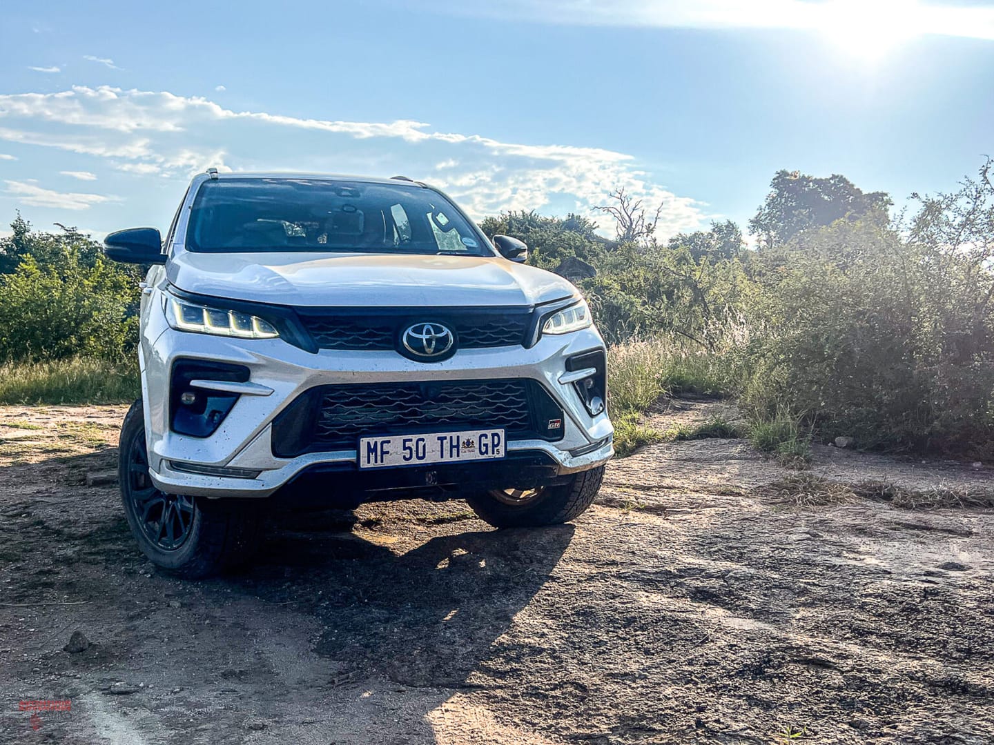 A vehicle travels towards Oase by 7 Star Lodges.