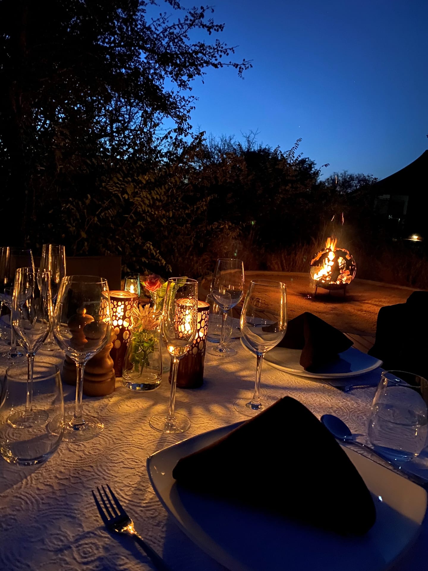 A dinner setting beside the private pool at Milestone at Oase.