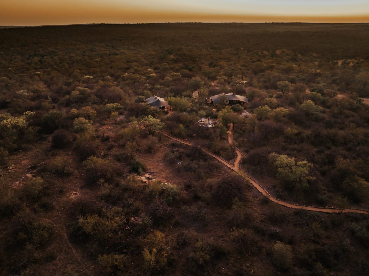 Bird's-eye view of the Milestone Suites at Oase before sunrise.