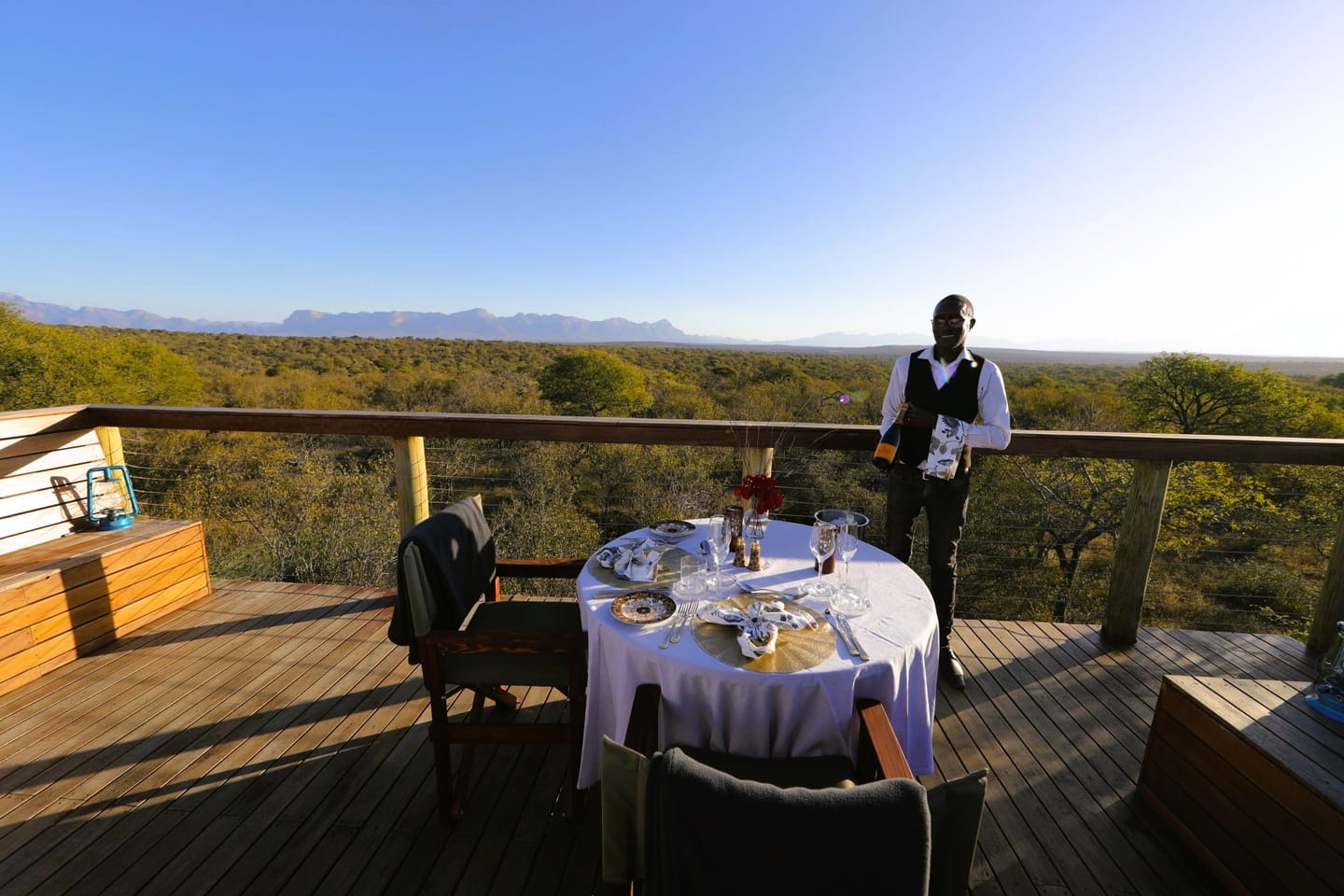 Sundowners at Oase's Treetop Sundowner Deck above the bush.
